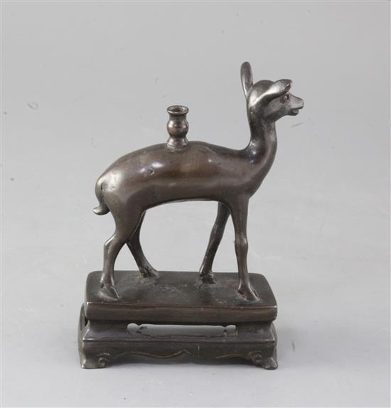 A Chinese bronze deer joss stick holder, 18th century, height 15cm